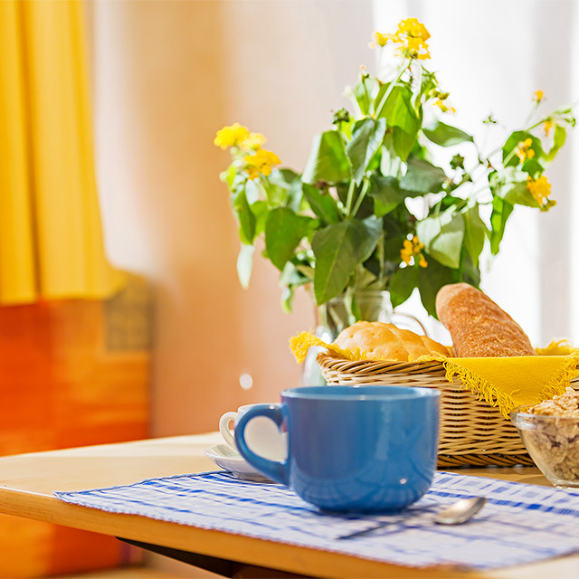 Yellow flowers on the table in a Basic Bungalow